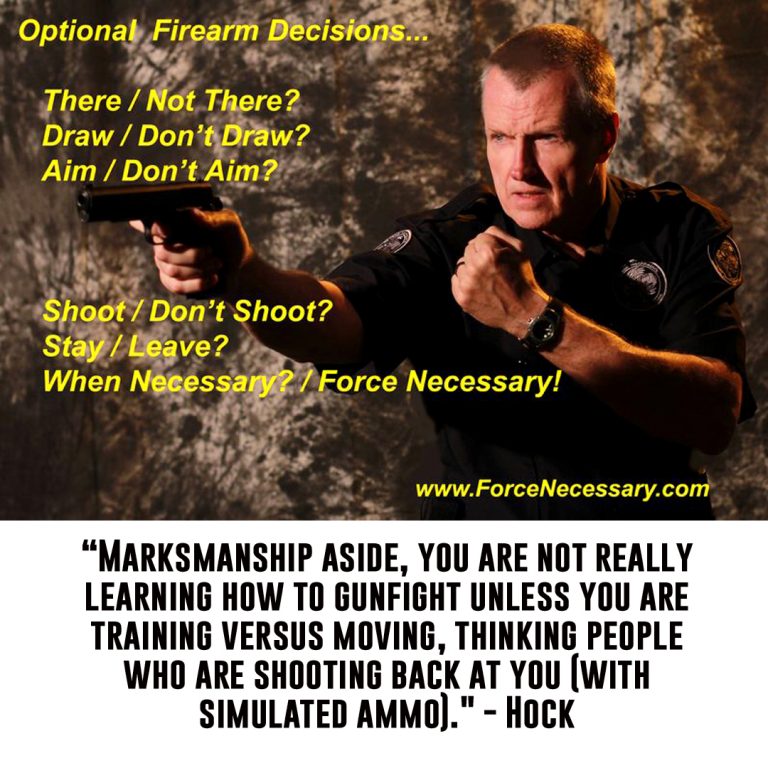 Hock standing with his arm extended pointing a gun at a target off in the distance, wearing a security uniform
