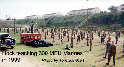 Hock hochheim on a stand, teaching special operations capable marines in Camp Pendelton